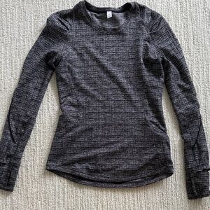 Lululemon long sleeve tee.  Hip length. Size 4. Black and grey print
